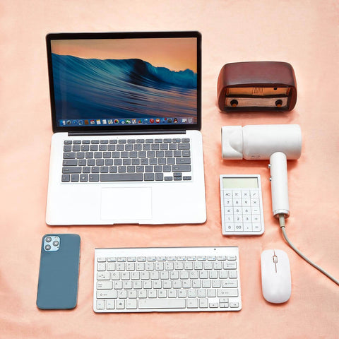 Various electronic devices on copper-nickel fabric for Faraday Fabric Shielding Cloth Copper Nickel for EMP Protection and RF Signal Blocker.