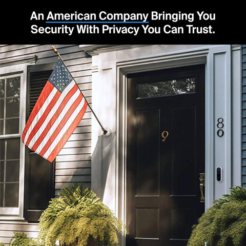 Front view of a house with an American flag displayed next to a door fitted with a 2K Video Doorbell With Wired Or Wireless Setup.