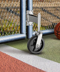 Eight Inch Heavy Duty Fence Gate Wheel With Spring Loaded Shock Absorber For Metal Tube Gates mounted on a blue metal gate.
