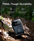 Trail 300 DC Power Bank Station 288Wh Portable Solar Generator resting on forest floor showing rugged durability and ports.