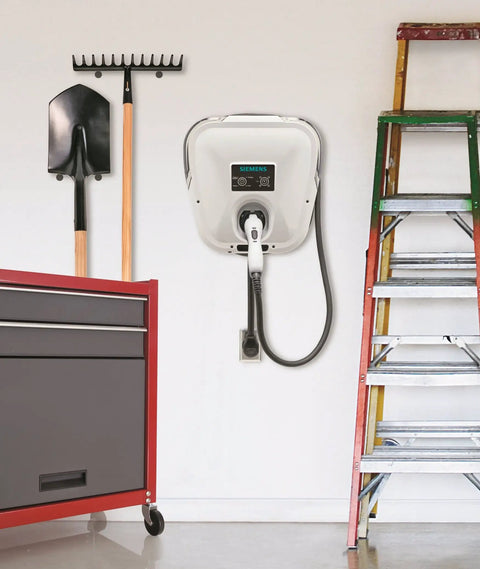 Badass Level 2 EV Charger Hard Wired With 30 Amp 240 Volt J1772 Compatibility mounted on garage wall near tools and ladder.