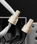 Tan Twist On Wire Connectors Box Of One Hundred For 22 To 8 AWG Electrical Lines With Ribbed Grip Caps and High Leverage Wings close-up.