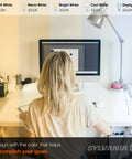 Person using computer under various light temperatures from soft white to daylight in a home office setting