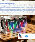 DIY Soldering Practice Kit And Electronic Speaker Build Project with LED lights, transparent acrylic shell on a wooden table.