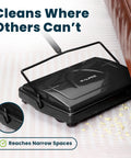 Grab And Go No Sweat Manual Sweeper For Carpets Hardwood And Rugs Triple Brush picks up debris under furniture.