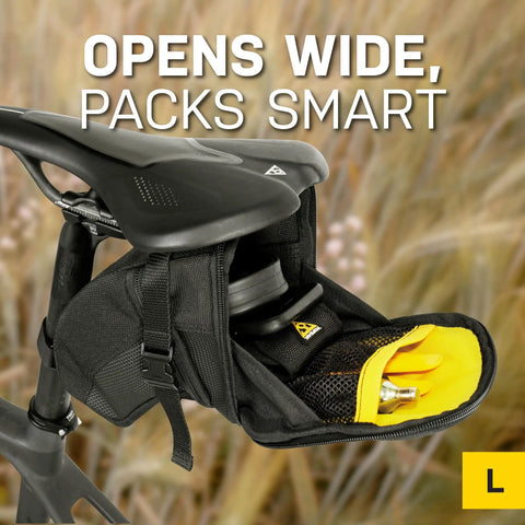 Aero Wedge Pack With Strap Mount For Bike Seat Post, large black storage bag showing open compartment with tools.