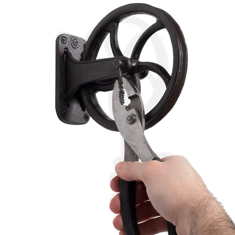 Heavy Duty Cast Iron Vintage Industrial Wheel Pulley Wall Mount For Farmhouse Lamps And Pendant Fixtures, 6.75 Inch Diameter, Black Finish, Old School Loft Vibe, DIY Ready Hanging Hardware being installed with pliers