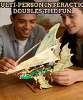 Two people assembling a Transparent Wing Phantom Starship Build Kit Dope Futuristic Mechanical Design Steampunk Sci Fi Style Model