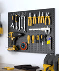 Heavy Duty Metal Pegboard Panels 4 Pack With 50 Hooks Black Wall Organizer displaying various tools in a home garage setting.