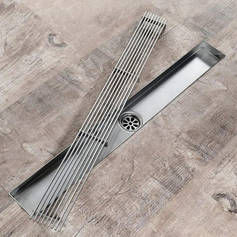 Top Shelf 304 Stainless Steel Linear Shower Drain With Built In Odor Guard And Slick Chrome Trim For Fresh Showers And Laundry Zones Quick Drop In Assembly Grip Tight Grate Level Surface Layout 60Cm Long on wooden floor.