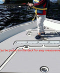 Child standing on a boat deck next to a 40 Inch EVA Foam Fish Ruler With Self Adhesive Backing For Boats And Kayaks, Big Readable Numbers, Quick Visual Fish Length Estimator For Fishing, Coolers, Yachts, Boating Accessories, Lightweight Waterproof affixed to the surface.