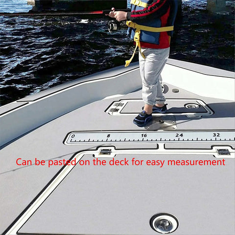 Child standing on a boat deck next to a 40 Inch EVA Foam Fish Ruler With Self Adhesive Backing For Boats And Kayaks, Big Readable Numbers, Quick Visual Fish Length Estimator For Fishing, Coolers, Yachts, Boating Accessories, Lightweight Waterproof affixed to the surface.