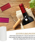 White PVC Heat Shrink Caps 120 Pack Wine Bottle Neck Covers with red and pink caps on a wooden table.
