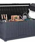 Extra Large 120 Gallon Outdoor Storage Deck Box With No Sweat Hydraulic Lift Lid holding garden tools and accessories.