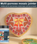 Heart-shaped mosaic art with tile pieces and grout jar labeled 'White Quick Dry Crystal Tile Grout Ready To Use Caulking Agent No Water Mixing Ultra Fast Dry For Glass Art Projects DIY Tile Craft Kit Supplies And Handmade Gifts No Mess Cleanup.'