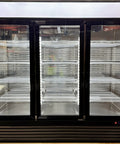 Heavy Hitter Commercial Merchandiser Freezer With Three Self Closing Glass Doors and Bulletproof Adjustable Shelving for No Nonsense Frozen Food Display In Busy Restaurants And Stores, showcasing empty shelves.