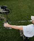 Archer aiming with Sync Drop Away Archery Arrow Rest With Smooth Cable Driven Draw For Consistent Shot Laterally Adjustable Launcher Arms