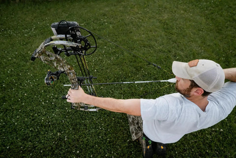 Archer aiming with Sync Drop Away Archery Arrow Rest With Smooth Cable Driven Draw For Consistent Shot Laterally Adjustable Launcher Arms
