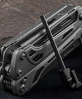 Fortitude BF 206 17 In 1 Stainless Steel EDC Multi Tool Pocket Knife with nylon sheath placed on dark surface