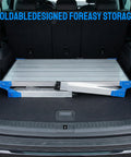 Height Adjustable Work Platform And Folding Aluminum Step Ladder Portable And Lightweight Yet Built Tough With 330 Lb Rating shown folded in car trunk