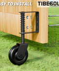Heavy Duty 4.3 Inch Gate Wheels Black Outdoor Fence Casters With 360 Degree Swivel Spring Loaded Design That Rolls Like Butter Takes The Strain Off Posts Quick Fit 2 Pack mounted on a wooden gate.