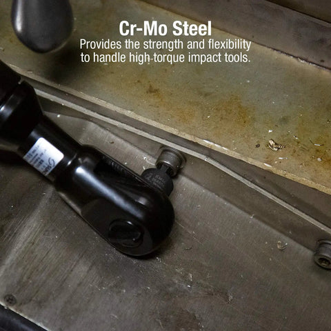 Low Profile Impact Hex Driver Set Three Eighths Inch Drive Sixteen Piece Dual Size Markings From One Quarter Inch To Three Quarters Inch SAE And Metric Chrome Moly Steel Solid One Piece Construction Fits Tight Spaces Heavy Duty Case ANSI Compliant in use with impact tool on metal surface.