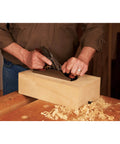 Pro Grade Number Four Bench Plane Built Like A Tank For Intense Shop Sessions Smooths Rough Boards Effortlessly being used on wood block.