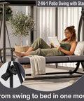 Woman relaxing on Modern Outdoor Patio Swing With Adjustable Canopy, 2 In 1 Porch Swing Bed With Removable Cushion, Gray