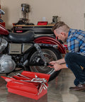 Man using Heavy Duty 18 Inch Cantilever Tool Box With 5 Tray Foldout Organizer Metal Red Storage Case next to motorcycle