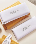 Hassle Free Direct Thermal Mailing Address Labels In Bright White on white envelopes for shipping, sized 1-1/8 X 3-1/2 inches.