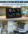 All In One Weather Station With Rain Gauge And Wireless Indoor Outdoor Sensors, Digital Thermometer Barometer Hygrometer, Atomic Clock, Real Time Forecasts And Alerts For Home Garden placed on table, rain gauge on patio.