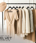Velvet Hangers 50 Pack Must Have Ultra Slim Non Slip Pant And Coat Hangers With Pants Bar And 360 Degree Swivel Hook Black showcasing wardrobe organization with various garments on hangers.