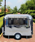 Premium Polished Mirror Food Trailer With Fold Down Awning And Stainless Steel Counter Space For Concession Operators And Mobile Coffee Shops Solid Gear To Crush Sales Daily exterior view with open serving window and polished finish.