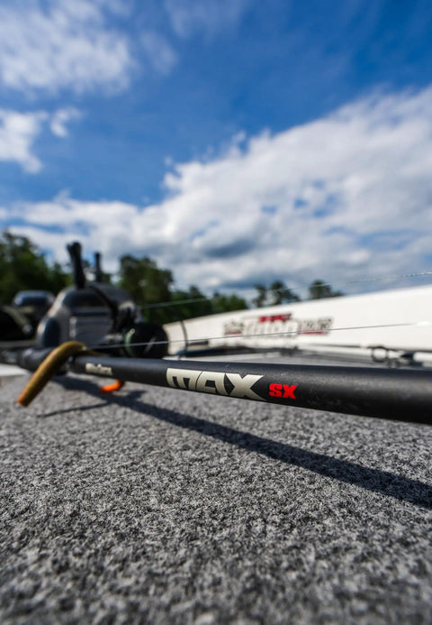 6 Ft 6 In Max SX Spinning Rod And Reel Combo Size 3000 on boat deck with clear sky