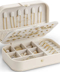 Open beige travel jewelry case showcasing double layer design with necklace hooks, ring holders, and dividers for bracelets and earrings.