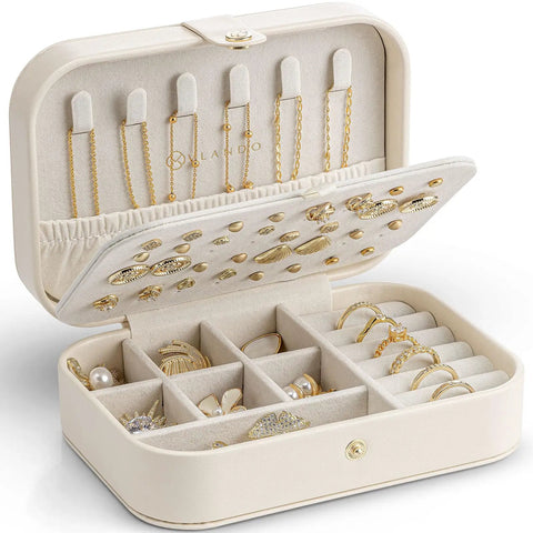 Open beige travel jewelry case showcasing double layer design with necklace hooks, ring holders, and dividers for bracelets and earrings.