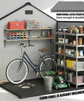Interior view of 6 By 4.4 Ft Backyard Storage Shed With Floor Durable 16mm Resin Construction showing tools and a bicycle stored inside.