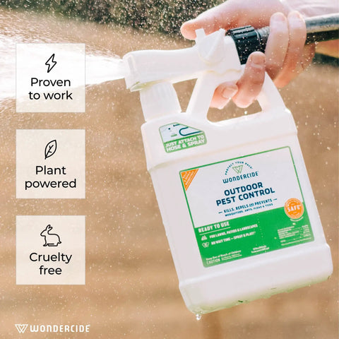 Person spraying Natural Outdoor Pest Control Spray With Essential Oils Kills Mosquitoes Ants Fleas Ticks And More Repels Pests And Keeps Your Yard Safe Around Pets And Kids 32 Oz bottle