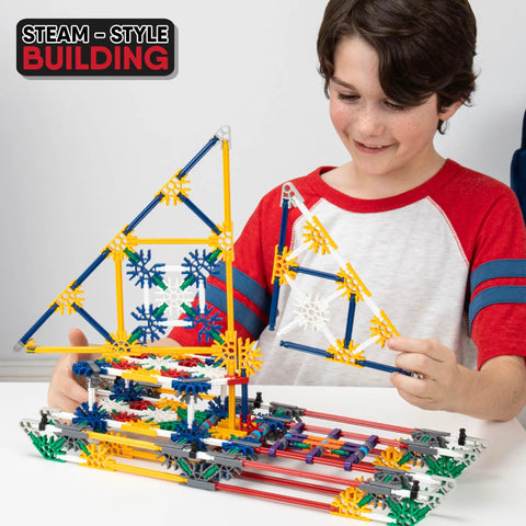 70 Model Building Set With 705 Pieces For STEM Learning And Creative Play, Ages 7 And Up, Amazon Exclusive Craft Kit For Endless Builds And Hands On Engineering Fun. boy building K'NEX model