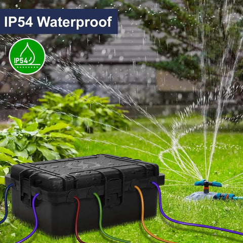 Heavy Duty Large Outdoor Electrical Box IP54 Waterproof Weatherproof 12x9x5 Inch Box Built To Handle 8 Cable Ports Protecting Power Strips, Extension Cords, Surge Protectors, Timers, Large Adapters And Above Ground Pool Accessories. Outdoor black box on lawn with sprinkler water spray