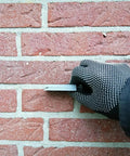 Hand holding spacer from Pro Grade Leveling And Spacing Shims Kit With 150 Pcs U Shaped Tile Spacers 1mm 2mm 3mm 4mm 5mm 6mm For Window And Door Installation And Woodworking By Left Bridge, installed between bricks