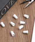 Ceramic wire connectors for 22-14 AWG; porcelain wire nuts, white, 25-pack, top-down view.