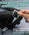 Hand holding self-adhesive tire puncture patch from Bike Puncture Repair Kit with Self Adhesive Tire Patches for Road MTB BMX and EBikes.