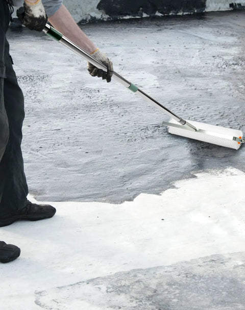 Worker using Spiked Screeding Roller For Self Leveling Floors, Pro Grade Latex Roller With 30mm Nails, includes telescopic rod