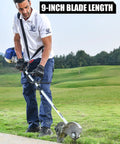 Person using Gas Powered 4 In 1 Weed Wacker with 9 inch wheeled edger on grass, 26cc engine, rubber handle visible