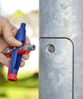 Hand using Universal Control Cabinet Key Pen Style With Clip Featuring Four Key Profiles for access to utility cabinet.