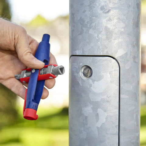 Hand using Universal Control Cabinet Key Pen Style With Clip Featuring Four Key Profiles for access to utility cabinet.