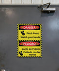 Bilingual Danger Pinch Point Watch Your Hands Sticker Set With Hands And Fingers Away Warnings installed on a metal door