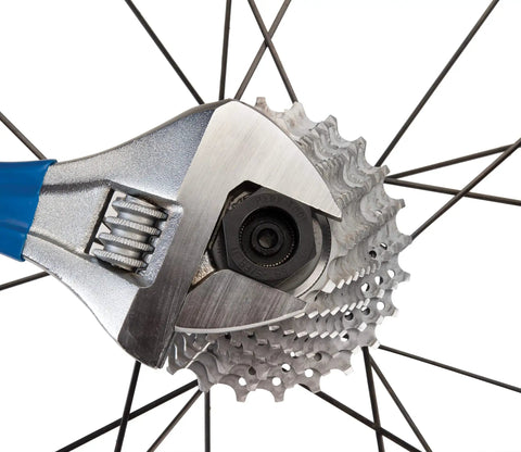 Bottom Bracket And Lockring Tool For Campagnolo Cassettes BBT 5 And FR 11 in use on bike wheel with wrench