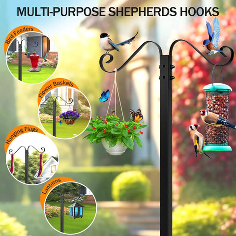 Multi-purpose shepherd hooks with bird feeders, flower baskets, flags, and lanterns displayed outdoors in garden setting.